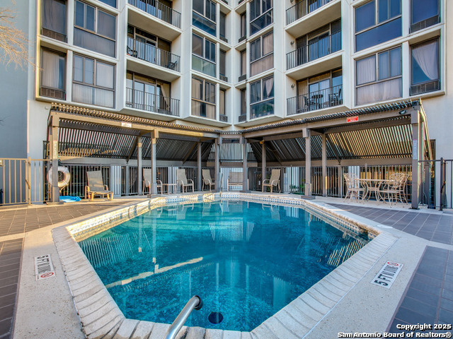 7701 Wurzbach Road, Unit 301 San Antonio, TX 78229 - Photo 14 of 42 a view of a building with a swimming pool