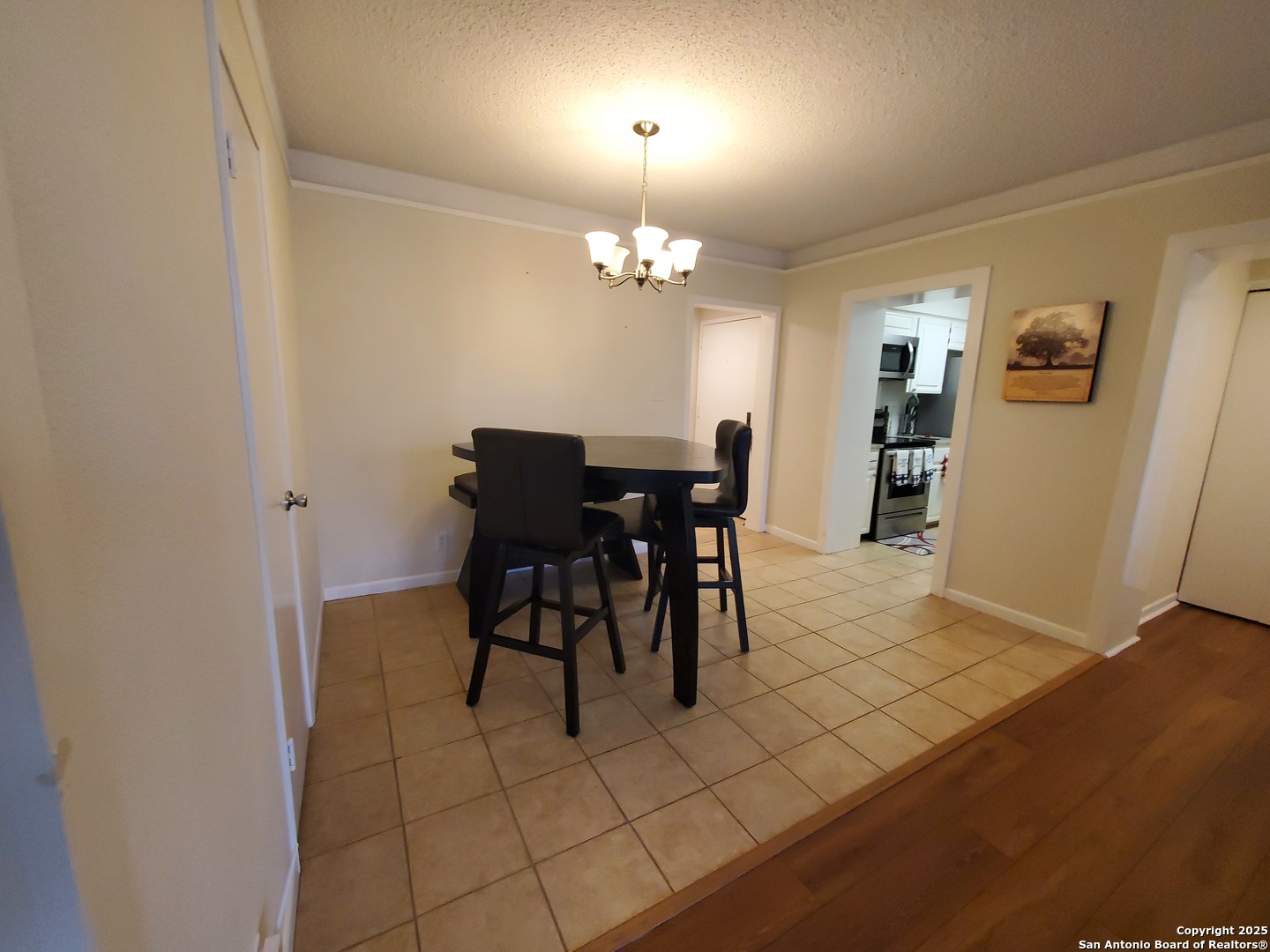 7701 Wurzbach Road, Unit 301 San Antonio, TX 78229 - Photo 23 of 42 a view of a dining room with furniture
