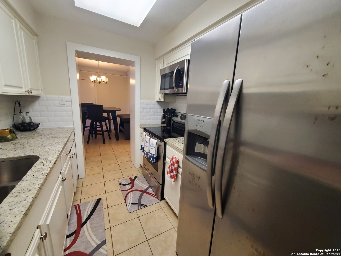 7701 Wurzbach Road, Unit 301 San Antonio, TX 78229 - Photo 28 of 42 a view of a kitchen from the dinning room