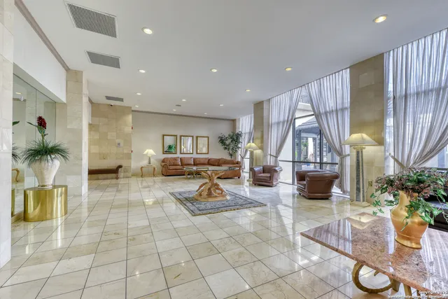 a room with a chandelier and couch