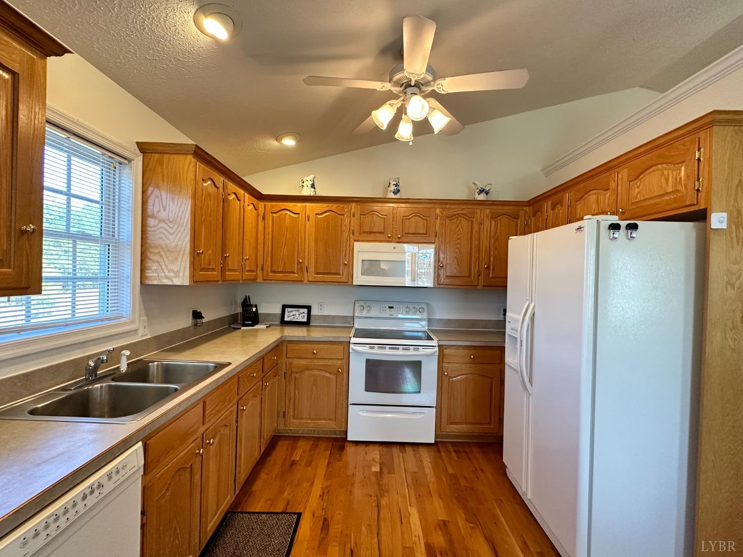 137 Rhonda Road Rustburg, VA 24588 - Photo 14 of 50 a kitchen with a sink stainless steel appliances cabinets and a window