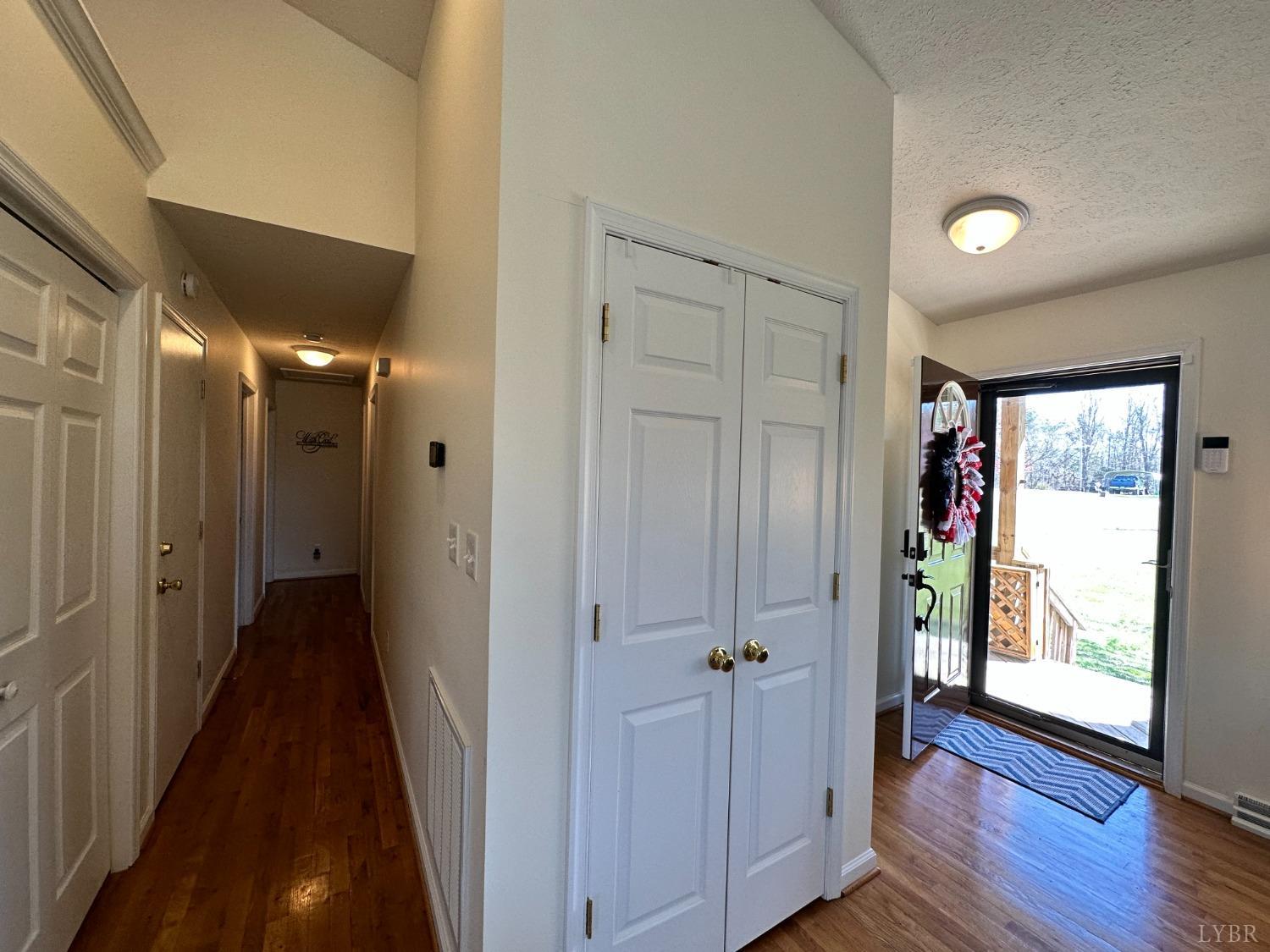 137 Rhonda Road Rustburg, VA 24588 - Photo 15 of 50 a view of a hallway with wooden floor and windows