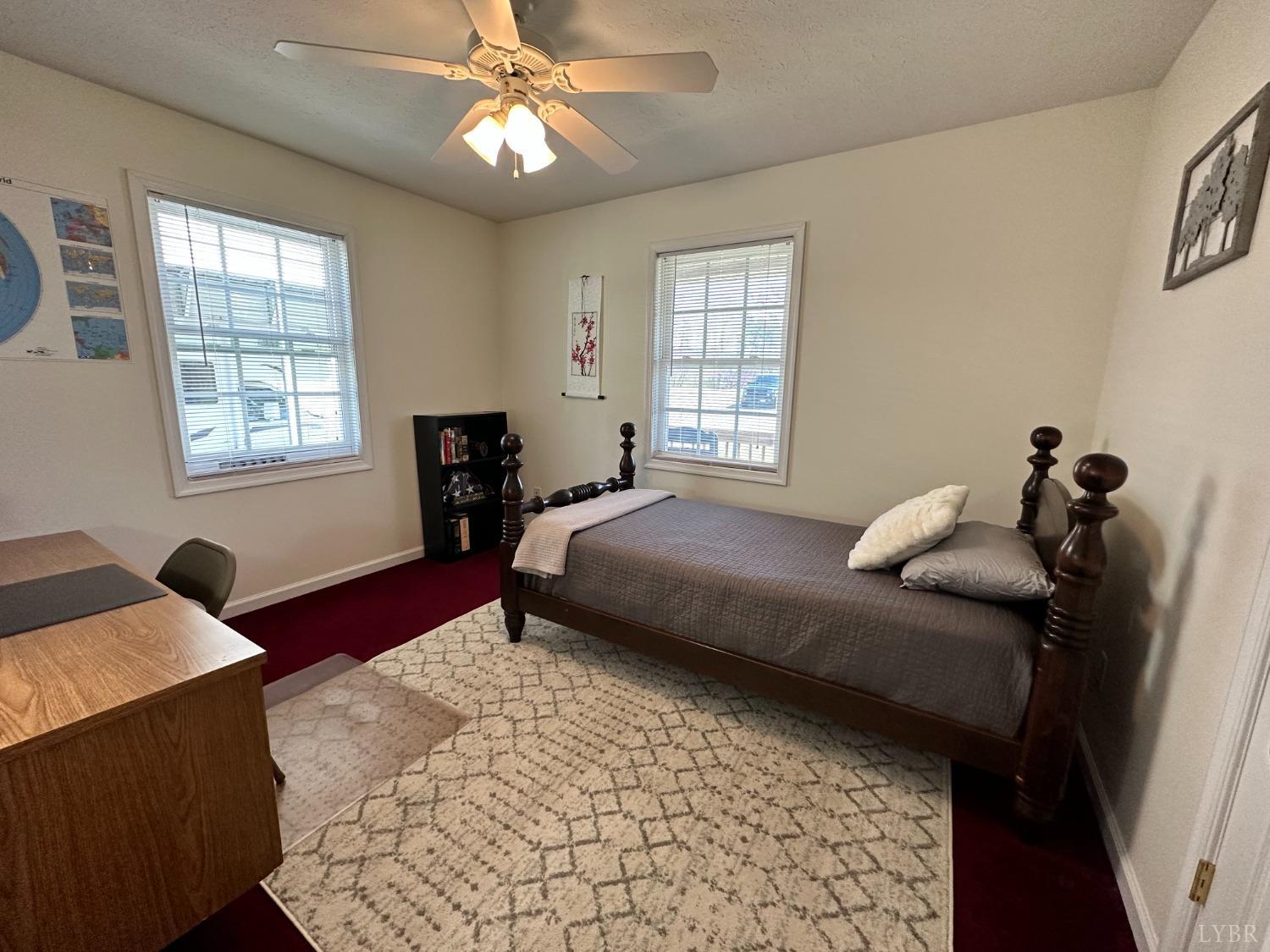 137 Rhonda Road Rustburg, VA 24588 - Photo 21 of 50 a bedroom with a bed and wooden floor