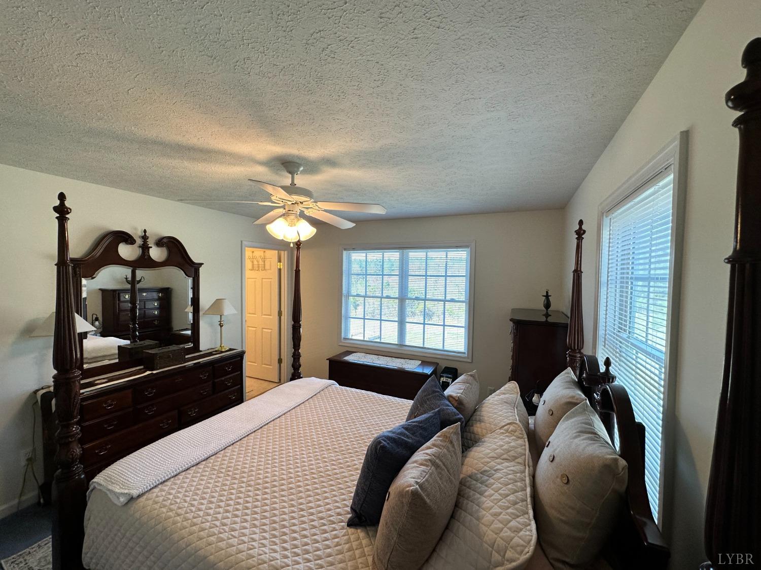 137 Rhonda Road Rustburg, VA 24588 - Photo 23 of 50 a bedroom with a bed and a flat tv screen on the dresser