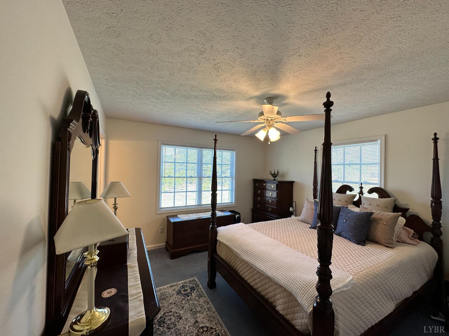 137 Rhonda Road Rustburg, VA 24588 - Photo 24 of 50 a bed room with a bed window and furniture