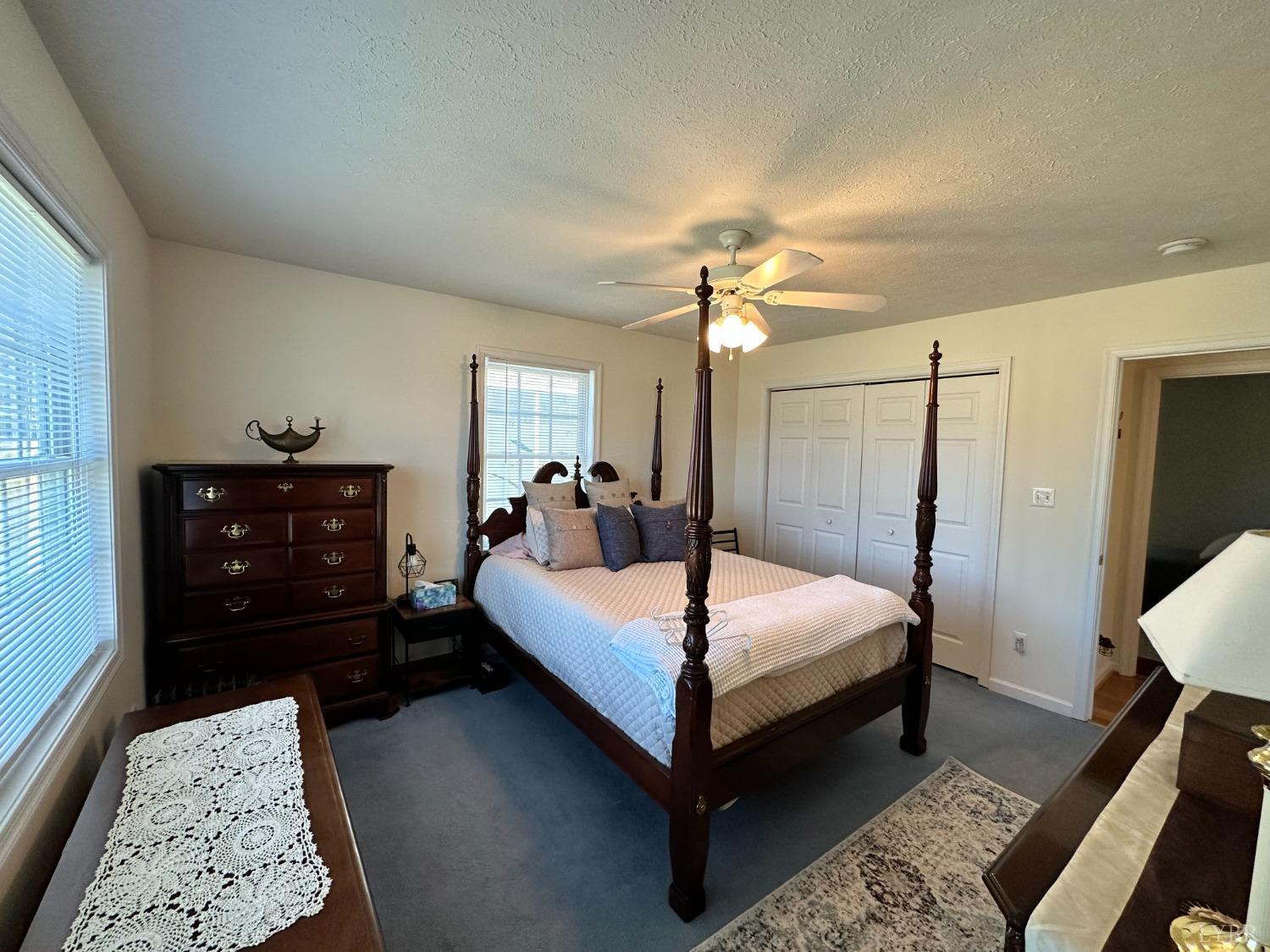 137 Rhonda Road Rustburg, VA 24588 - Photo 25 of 50 a bedroom with a bed and a lamp on dresser