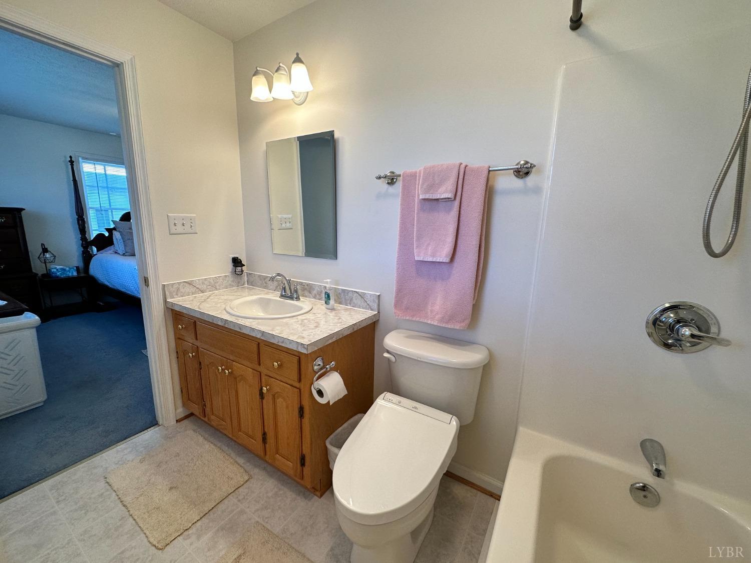 137 Rhonda Road Rustburg, VA 24588 - Photo 27 of 50 a bathroom with a sink mirror vanity and toilet