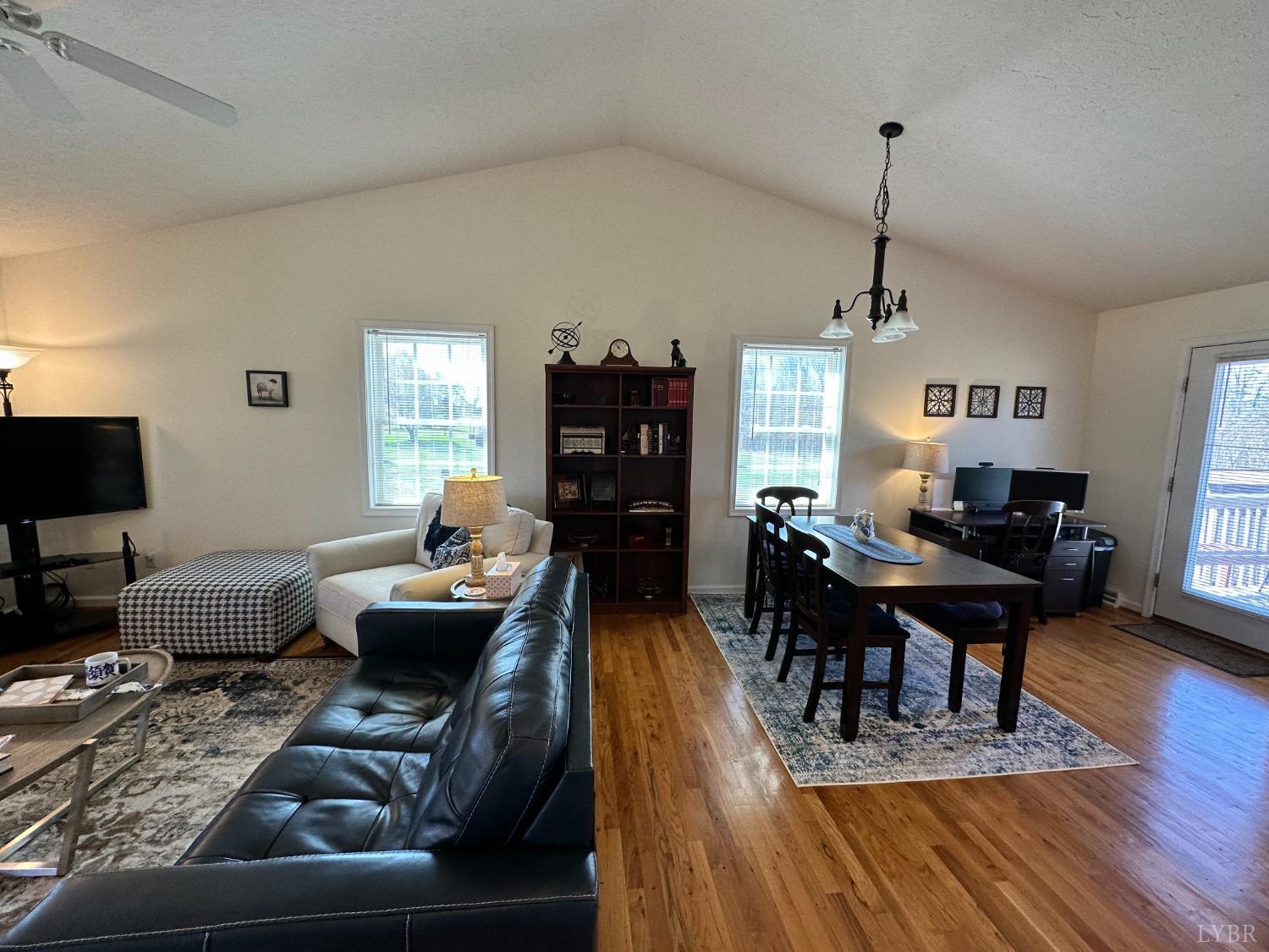 137 Rhonda Road Rustburg, VA 24588 - Photo 9 of 50 a living room with furniture dining table a lamp and a window