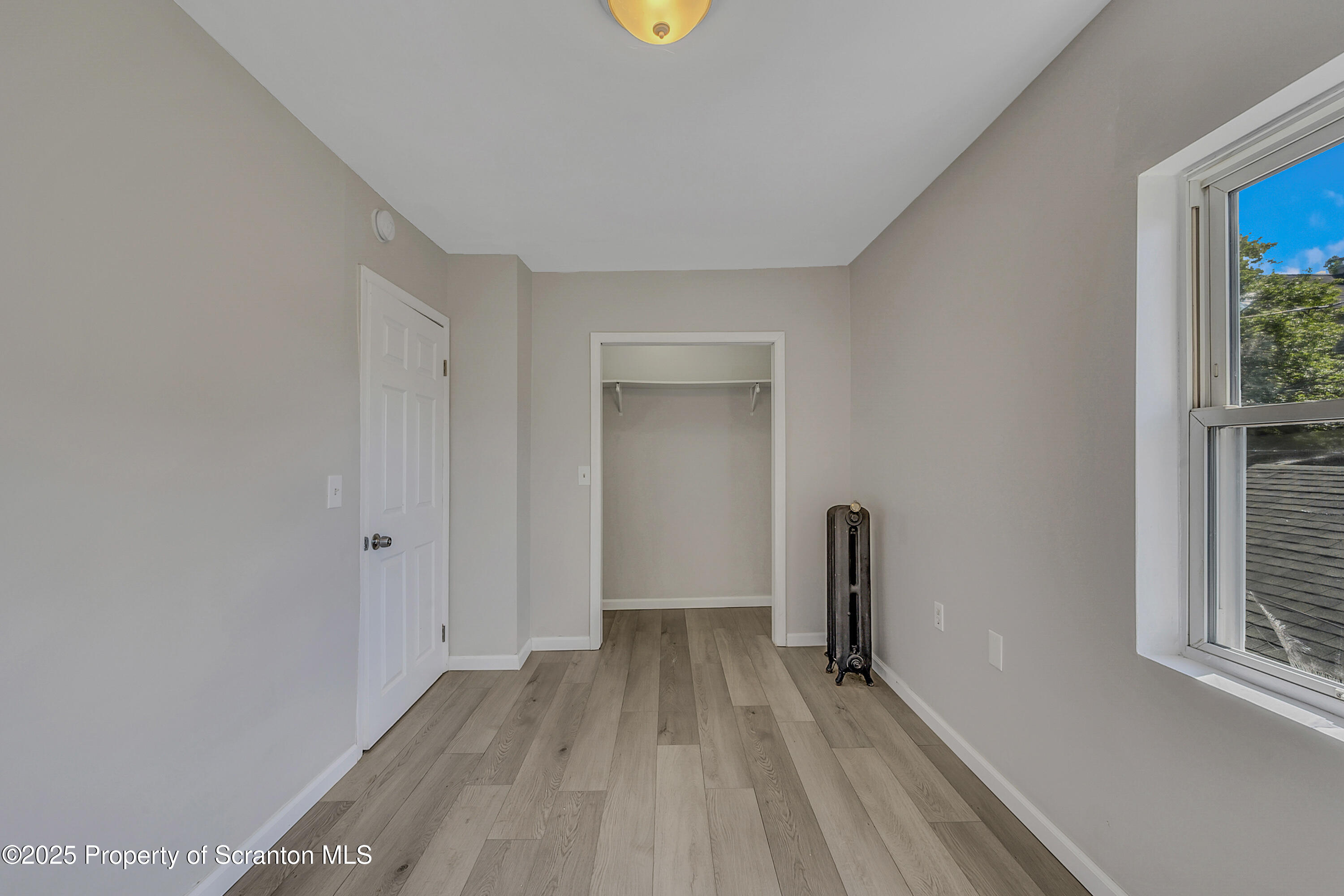 514 Stipp Court Scranton, PA 18510 - Photo 13 of 23 a view of room with window and wooden floor