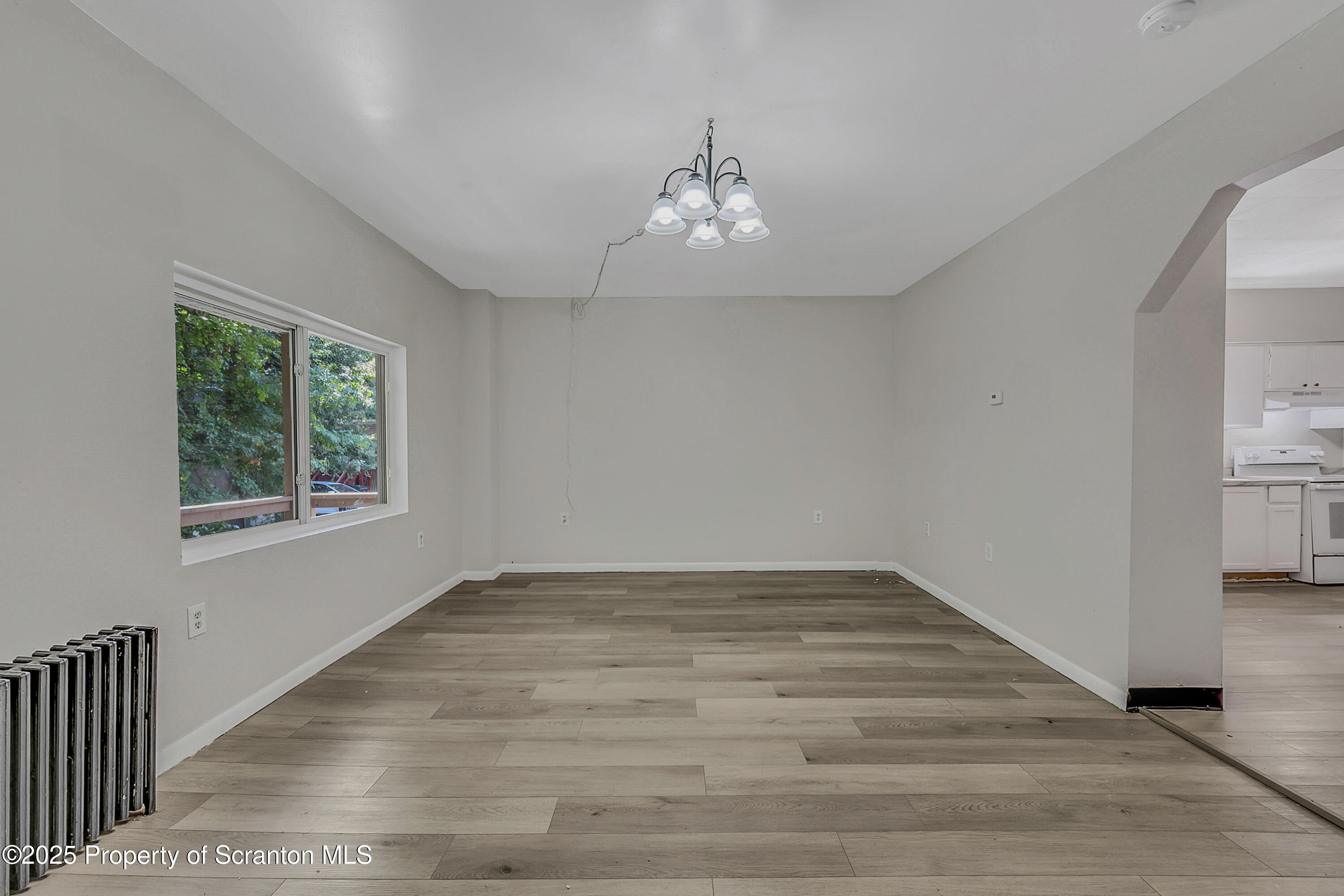 514 Stipp Court Scranton, PA 18510 - Photo 5 of 23 a view of an empty room with wooden floor and a window