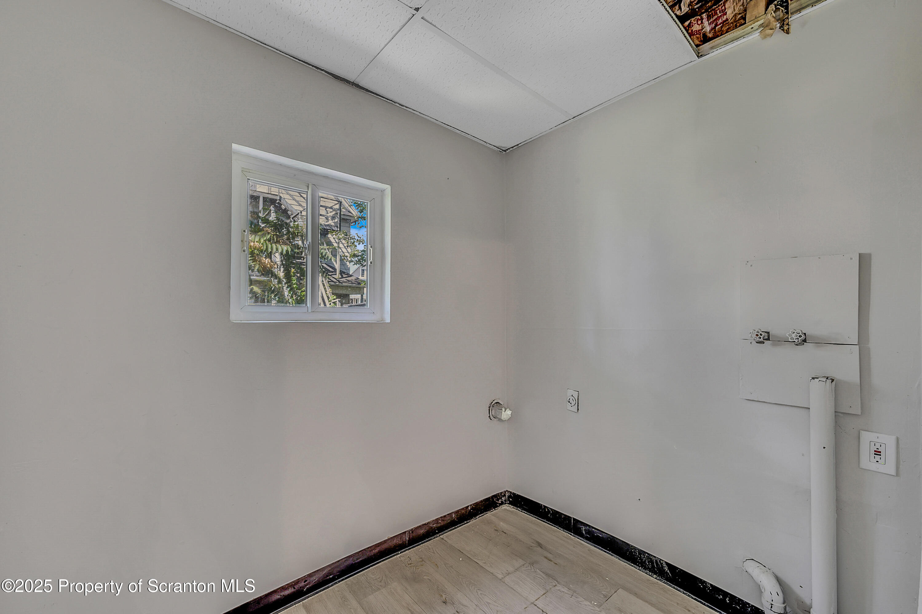 514 Stipp Court Scranton, PA 18510 - Photo 9 of 23 a view of a hallway with paintings on the wall