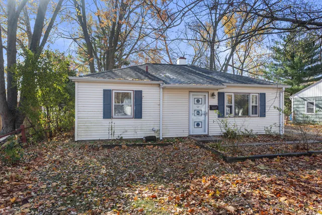 a house with trees in the background