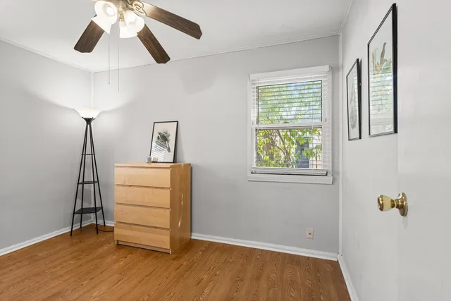 a view of room with window and wooden floor