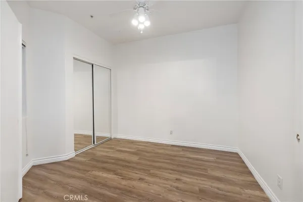 a view of room with wooden floor