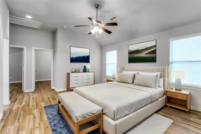 a bedroom with a bed and a mirror