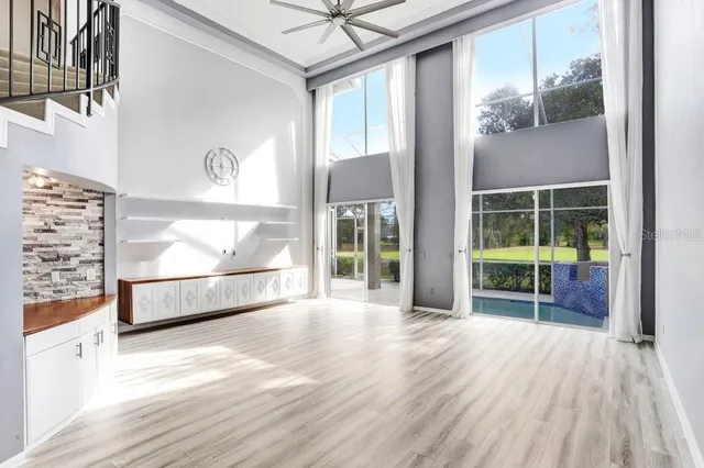 a kitchen with granite countertop white cabinets stainless steel appliances and sink