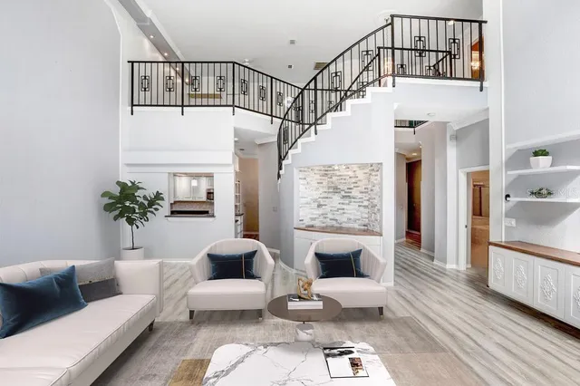 a spacious bathroom with a large tub shower and sink