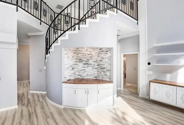 a bathroom with a tub sink and mirror