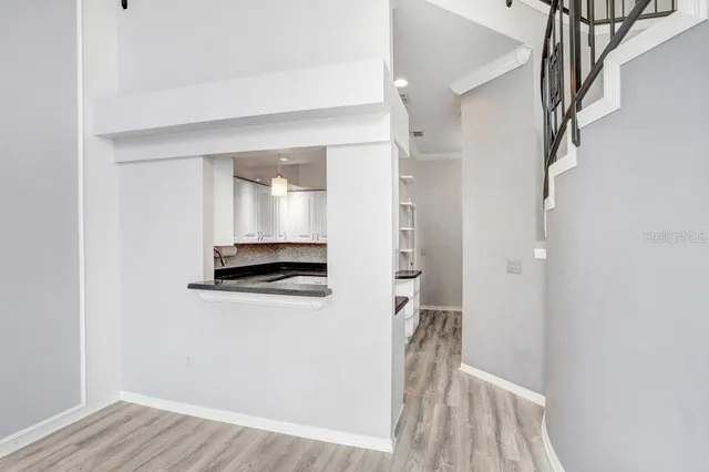 a bathroom with a sink a toilet and shower curtain