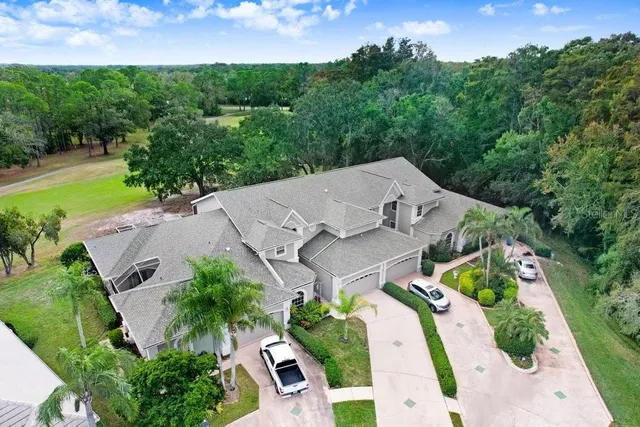 an aerial view of a house with garden space and street view