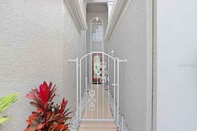 a view of a hallway with wooden floor and entryway