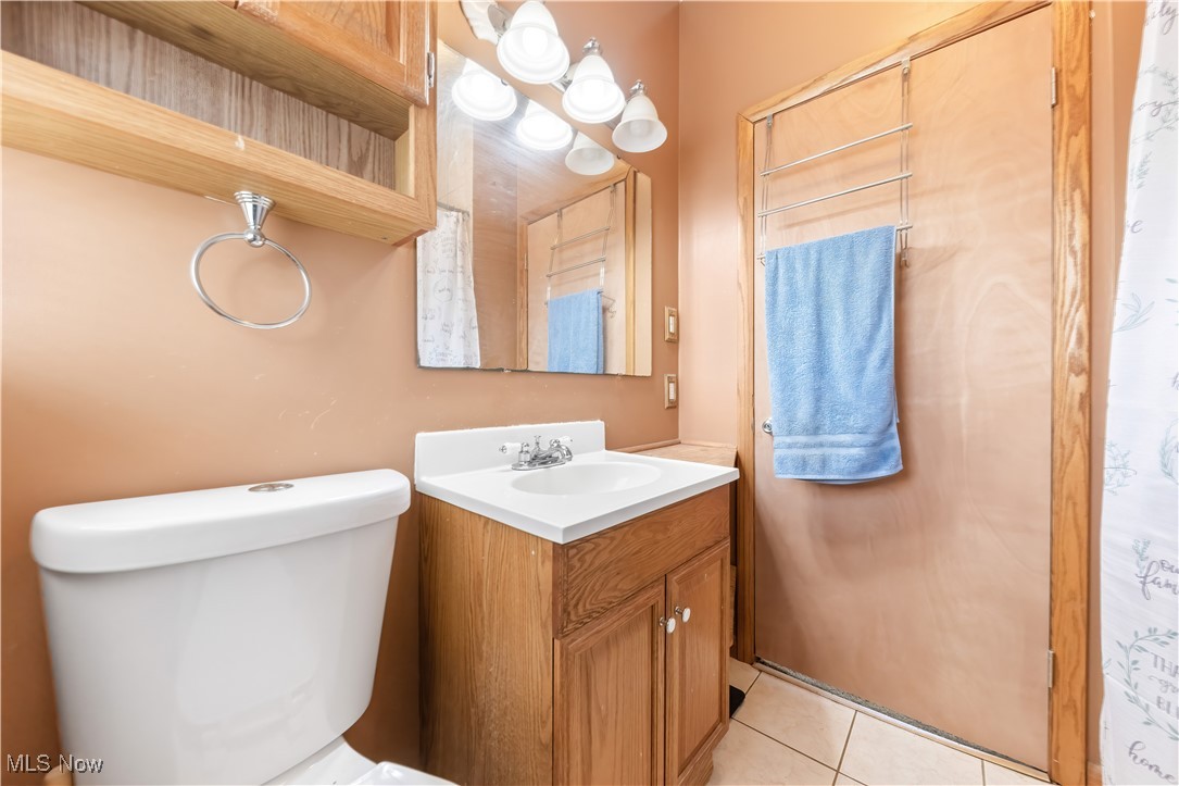 349 Gibbs Road Akron, OH 44312 - Photo 18 of 31 Bathroom with tile patterned flooring, vanity, and toilet