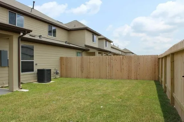 a view of a backyard of the house