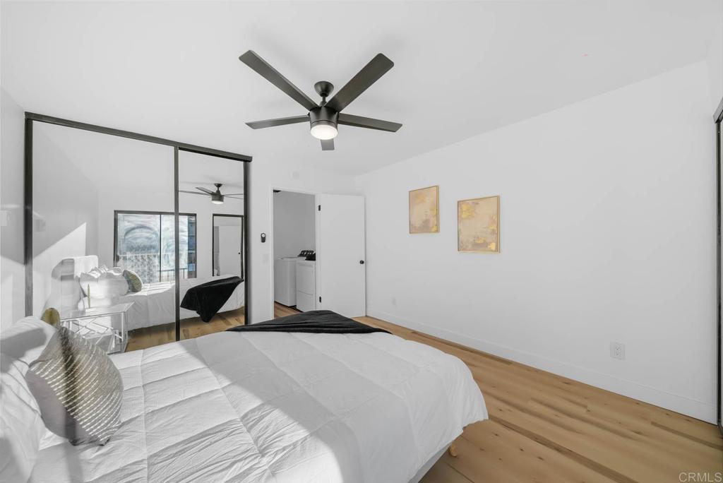 2360 Hosp Way, Unit 331 Carlsbad, CA 92008 - Photo 16 of 40 a spacious bedroom with a bed and ceiling fan
