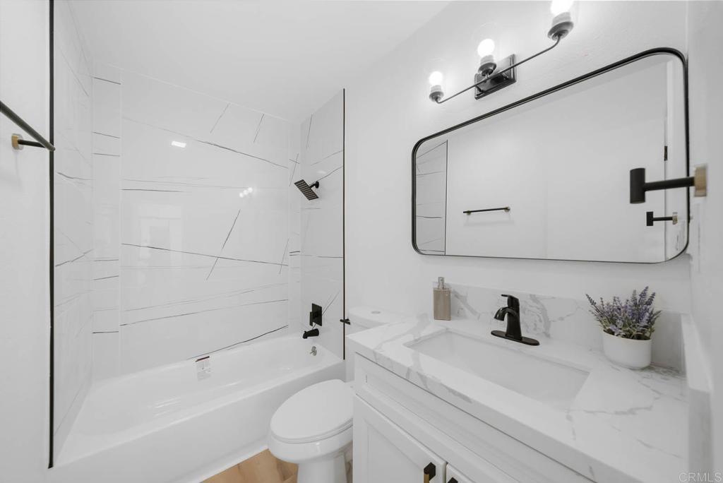 2360 Hosp Way, Unit 331 Carlsbad, CA 92008 - Photo 17 of 40 a bathroom with a sink a toilet and shower