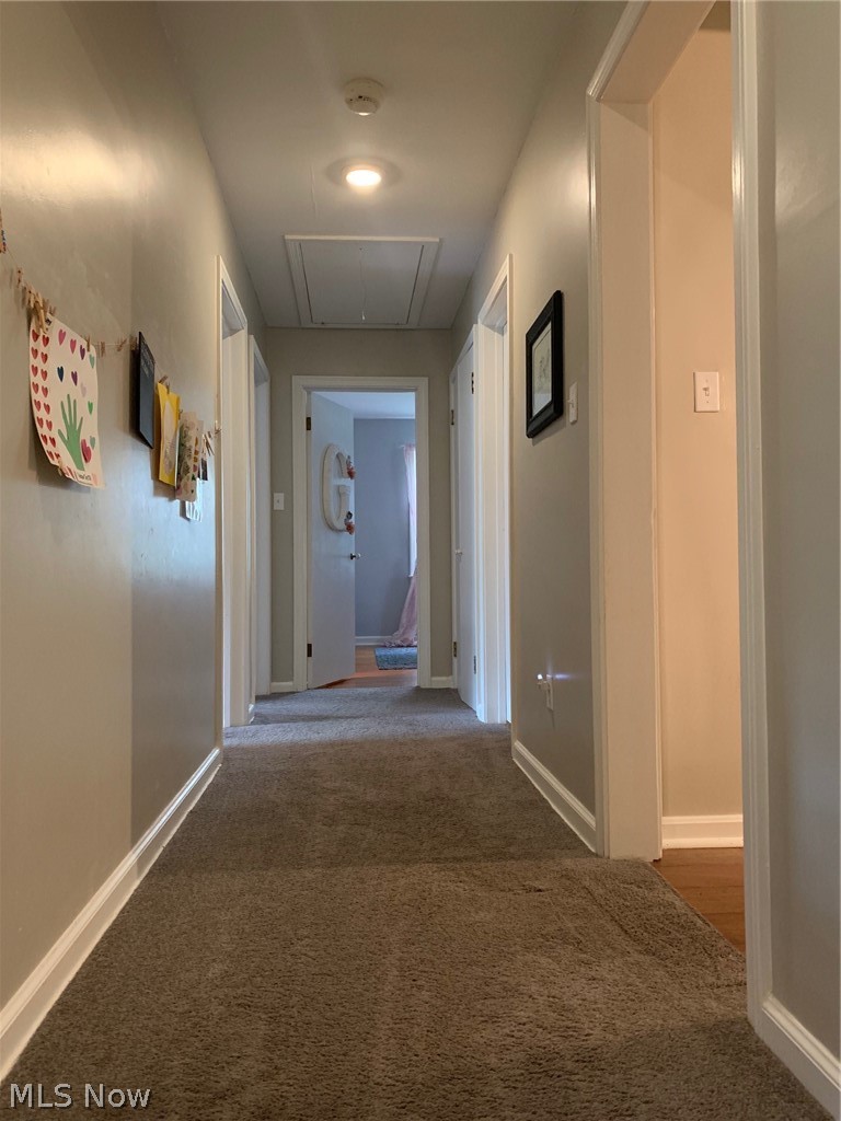 1827 Enslee Road Coshocton, OH 43812 - Photo 19 of 29 Wide hallway from front foyer to 3 bedrooms and bath