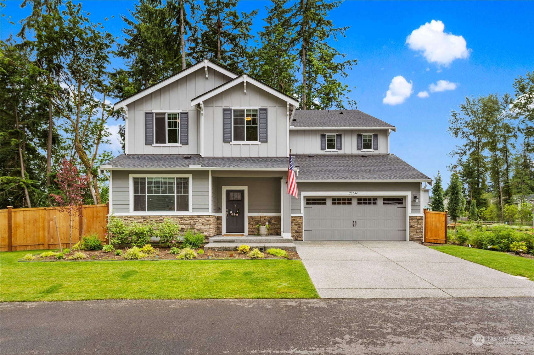 20004 89th Drive Northeast Bothell, WA 98011 - Photo 1 of 40 a front view of a house with garden