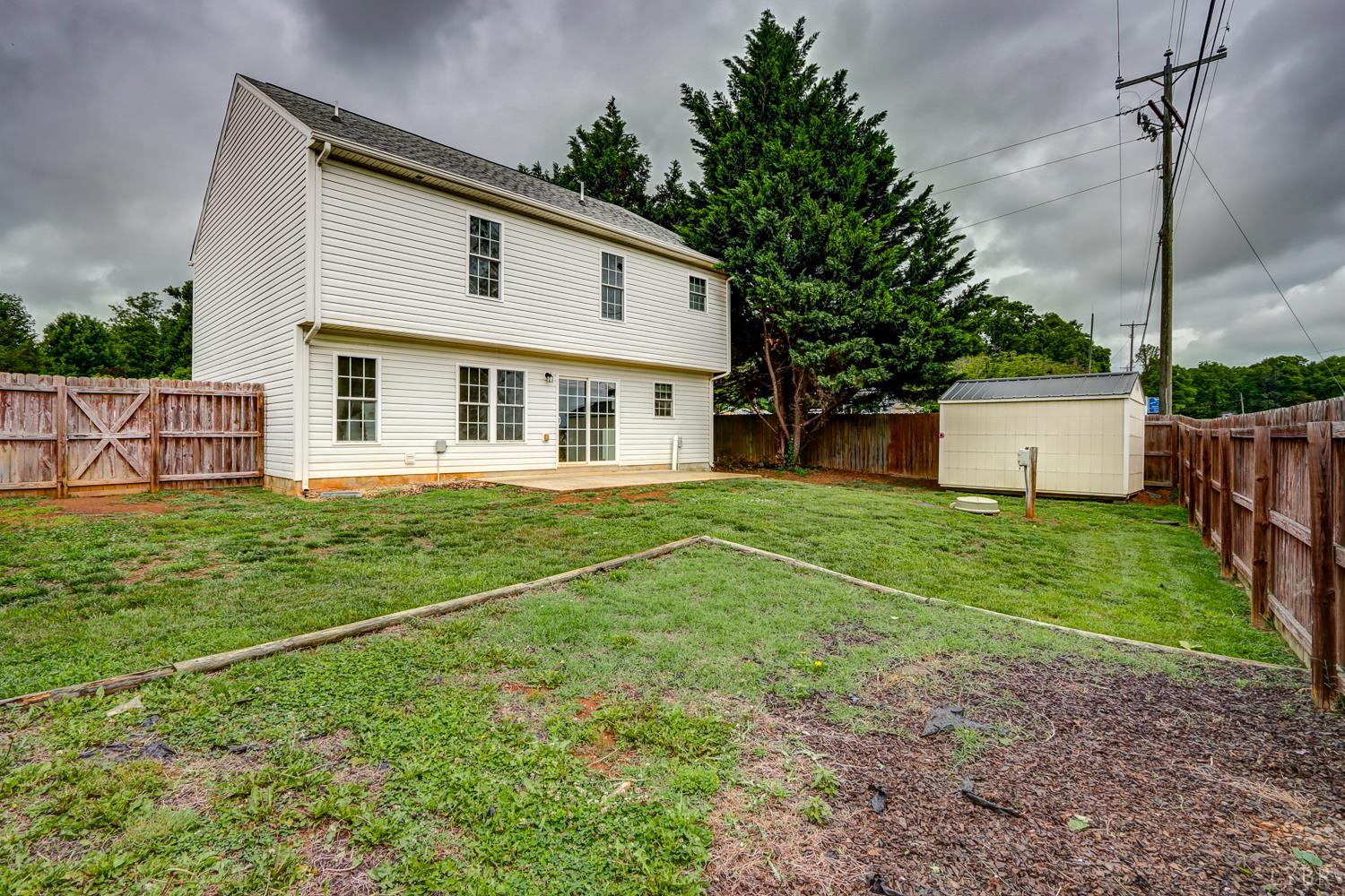 1057 Old Trail Road Forest, VA 24551 - Photo 48 of 49 a front view of house with a garden