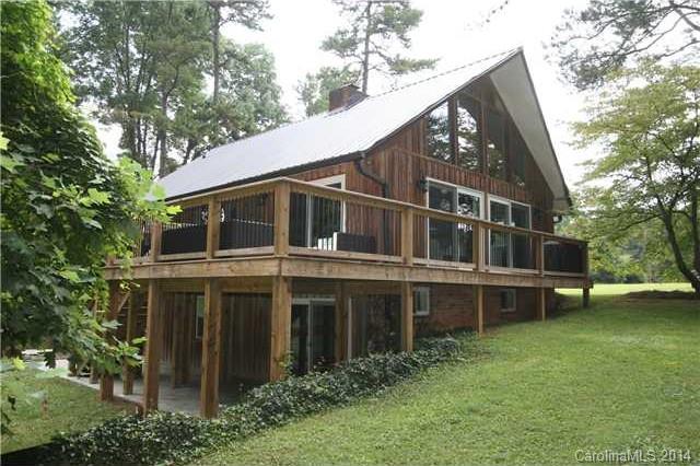 6795 Alanbrook Road Charlotte, NC 28215 - Photo 1 of 11 a view of a house with a yard