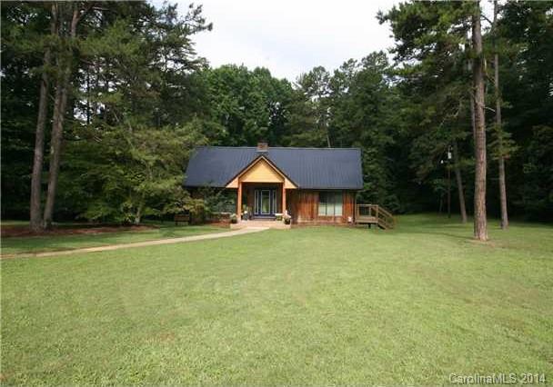 6795 Alanbrook Road Charlotte, NC 28215 - Photo 2 of 11 a backyard of a house with table and chairs