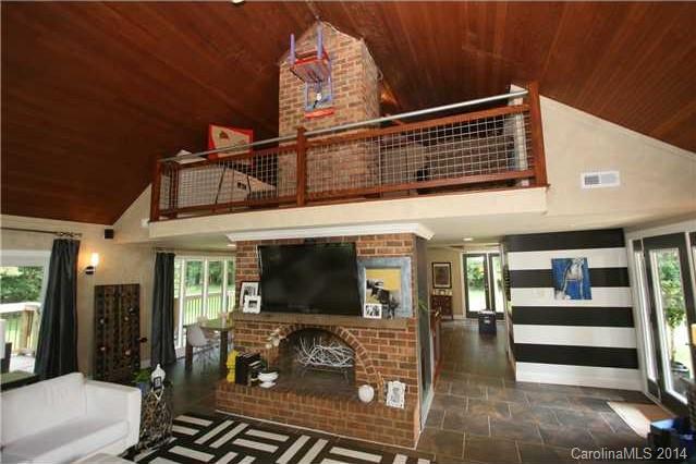 6795 Alanbrook Road Charlotte, NC 28215 - Photo 3 of 11 a view of a living room and a flat screen tv