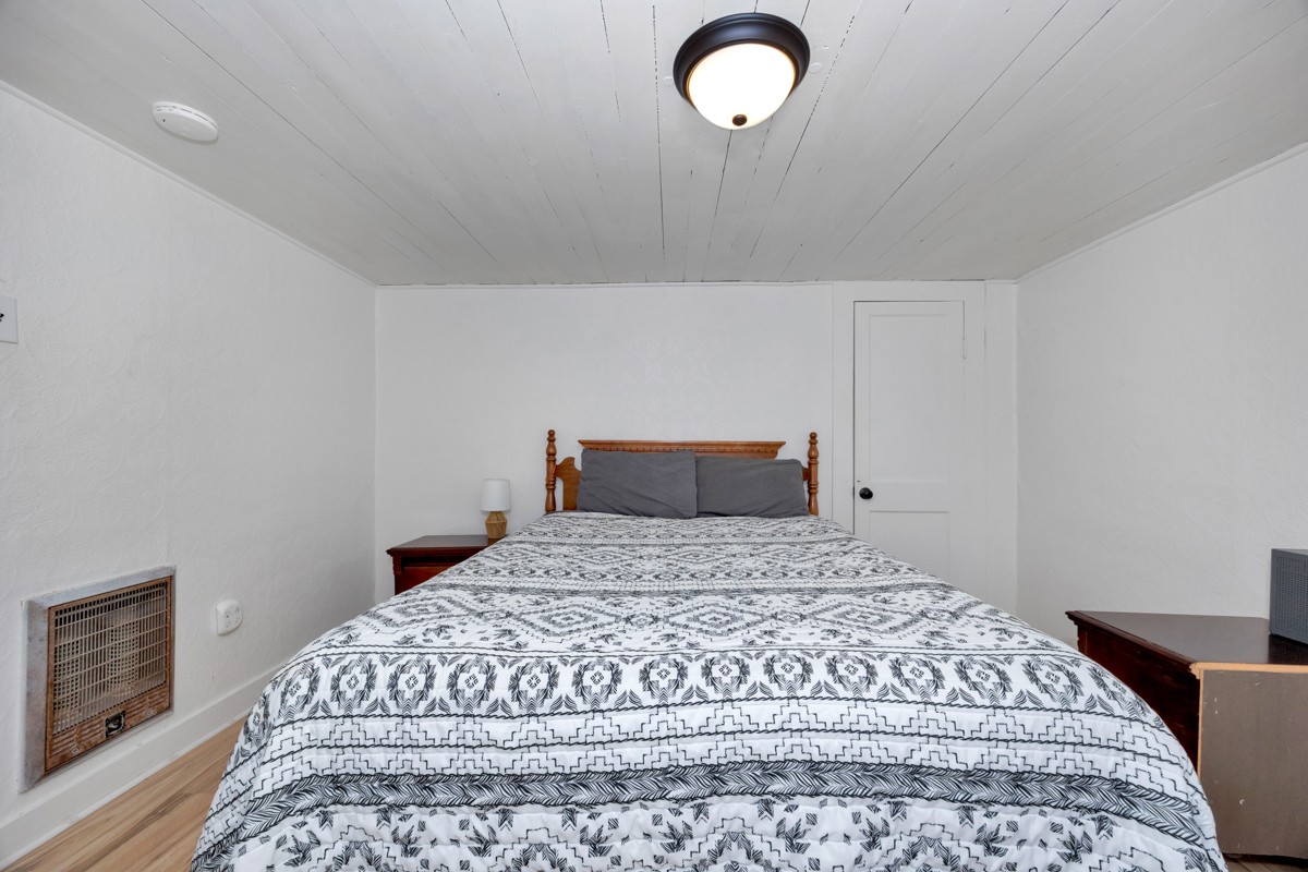 61 Minnie Brown Road Ardmore, TN 38449 - Photo 18 of 37 a bedroom with a large bed and a potted plant