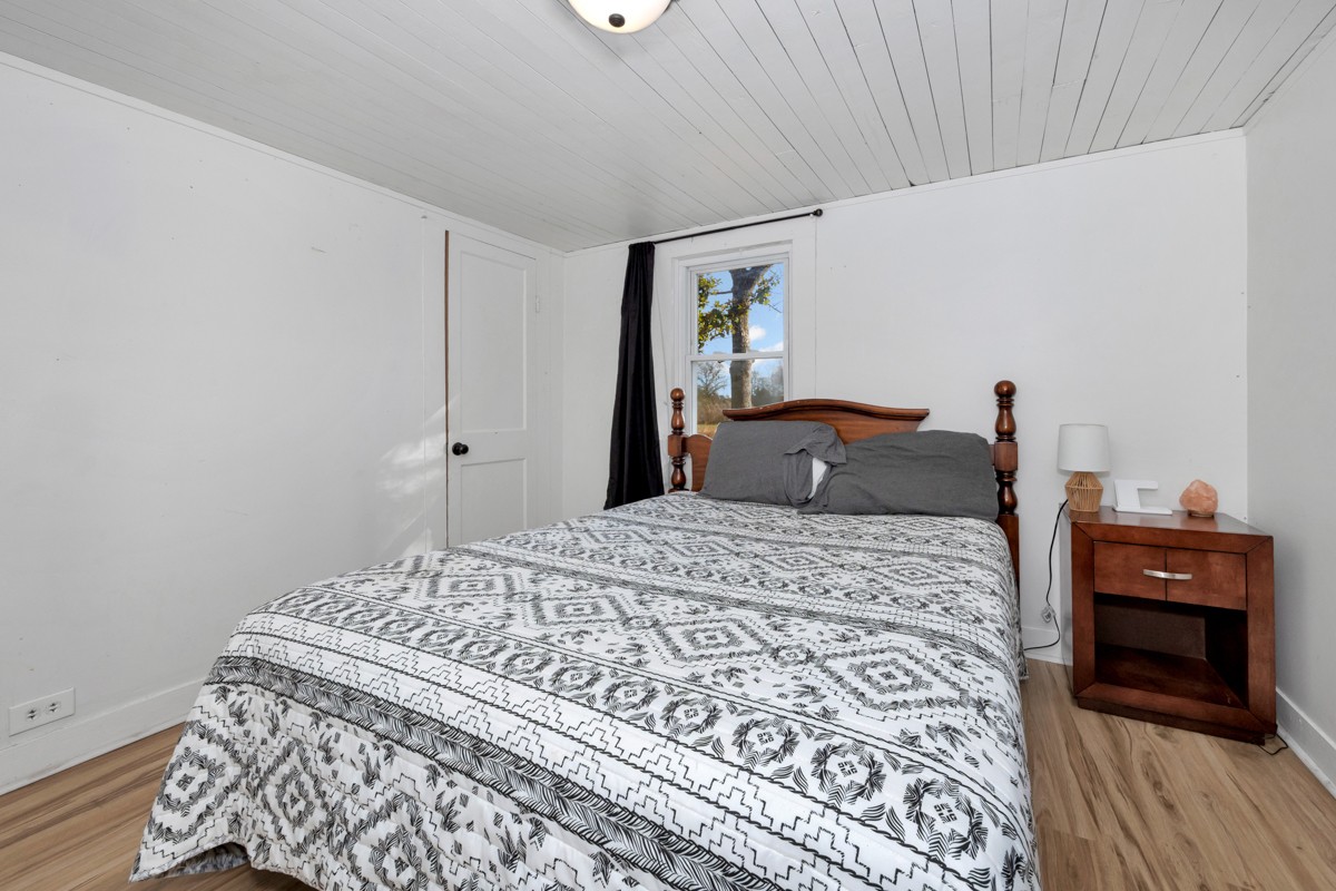 61 Minnie Brown Road Ardmore, TN 38449 - Photo 20 of 37 a bedroom with a bed and a mirror