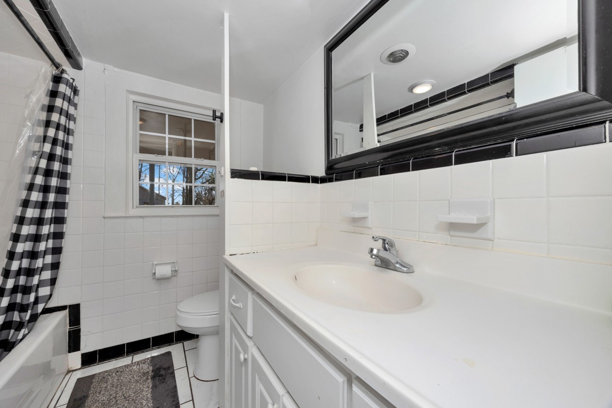 61 Minnie Brown Road Ardmore, TN 38449 - Photo 21 of 37 a bathroom with a sink and a mirror