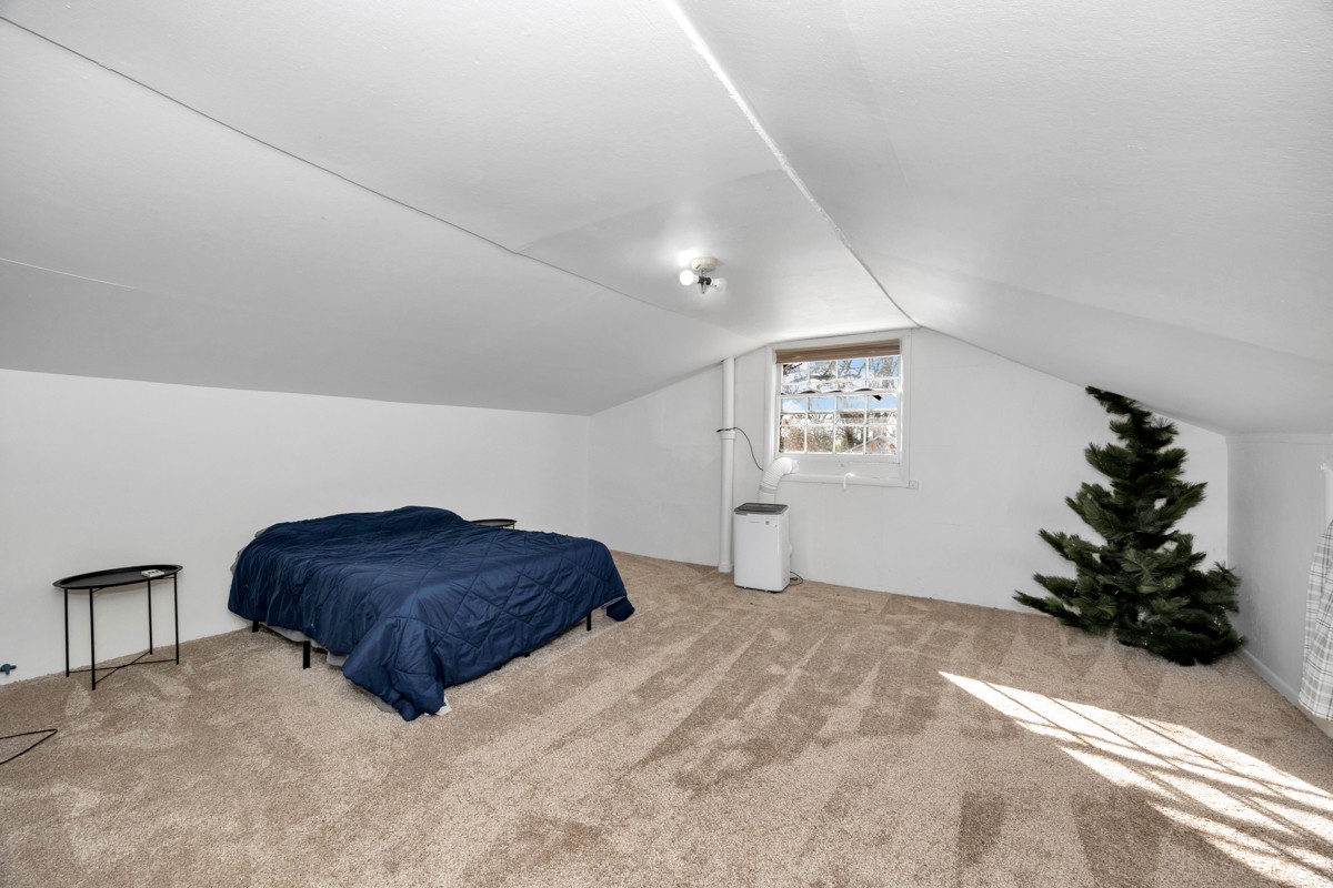 61 Minnie Brown Road Ardmore, TN 38449 - Photo 25 of 37 a bedroom with a bed window and flowerpot