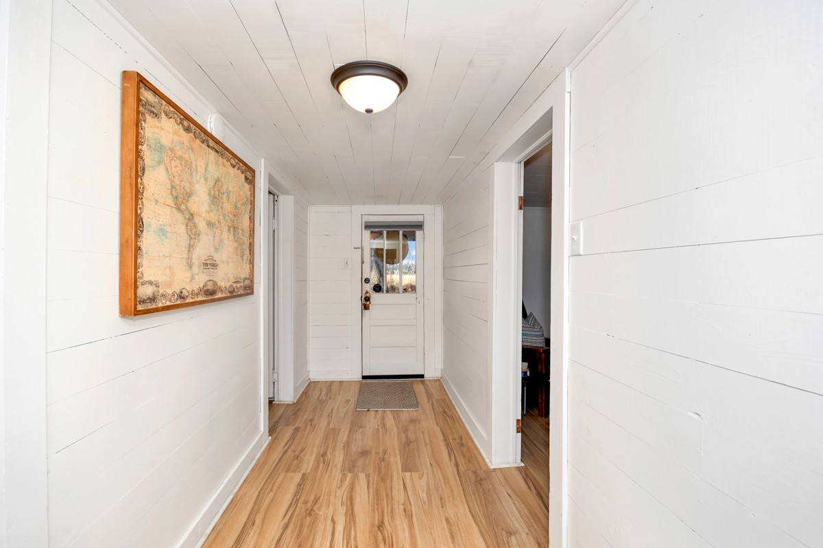 61 Minnie Brown Road Ardmore, TN 38449 - Photo 3 of 37 a view of a hallway with wooden floor