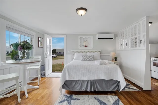 a bedroom with a bed and a table