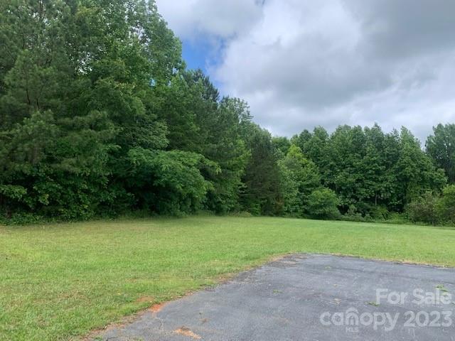 1325 Peachtree Road Charlotte, NC 28216 - Photo 6 of 6 a view of a field with a trees in the background