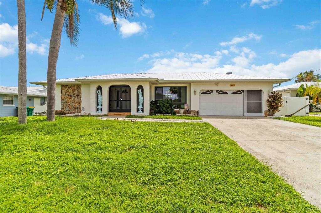 18606 Briggs Circle Port Charlotte, FL 33948 - Photo 1 of 44 a front view of a house with garden