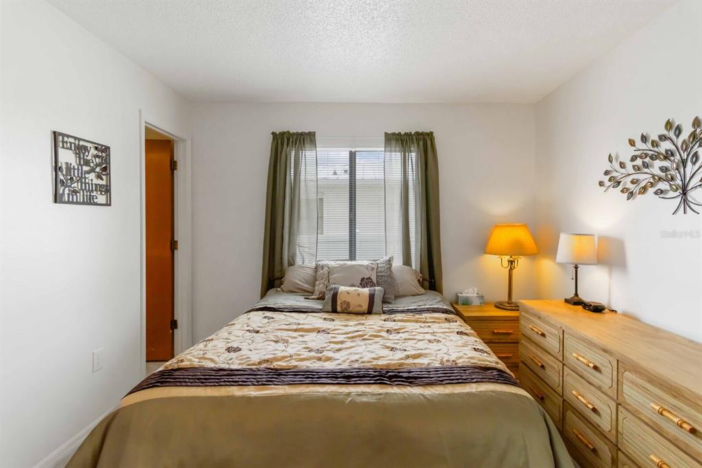 18606 Briggs Circle Port Charlotte, FL 33948 - Photo 20 of 44 a bedroom with a bed and window