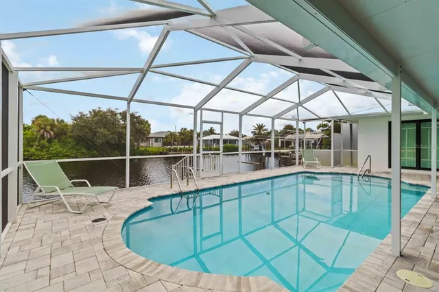 a view of a swimming pool with a patio