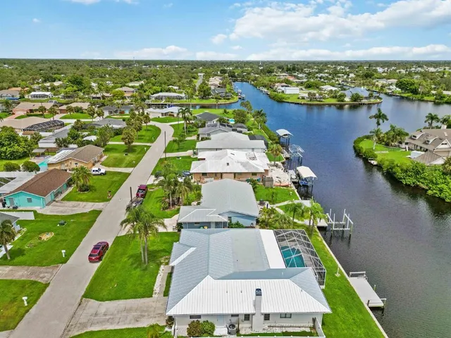 an aerial view of a house with a ocean view