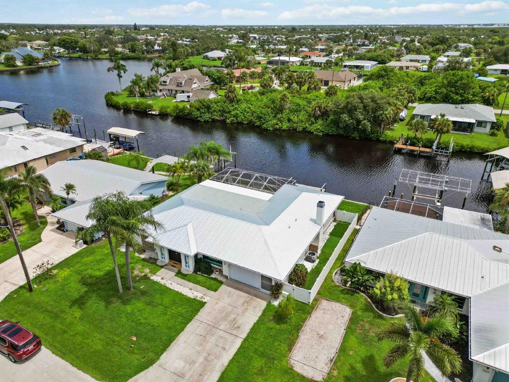 18606 Briggs Circle Port Charlotte, FL 33948 - Photo 41 of 44 an aerial view of a house with outdoor space lake view and boat