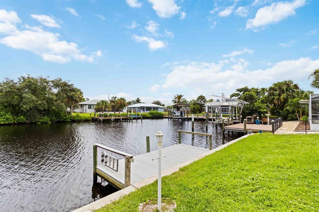 18606 Briggs Circle Port Charlotte, FL 33948 - Photo 43 of 44 a view of a lake with houses in front of it