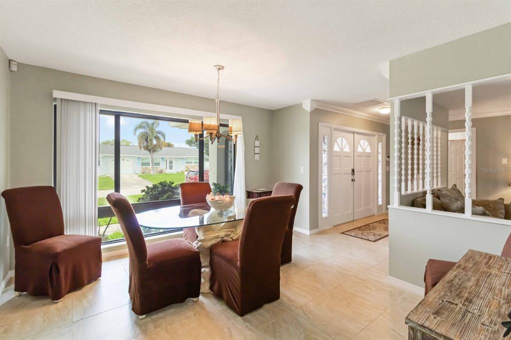 18606 Briggs Circle Port Charlotte, FL 33948 - Photo 7 of 44 a living room with furniture and large windows
