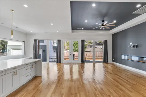a large hall with stainless steel appliances granite countertop a large window